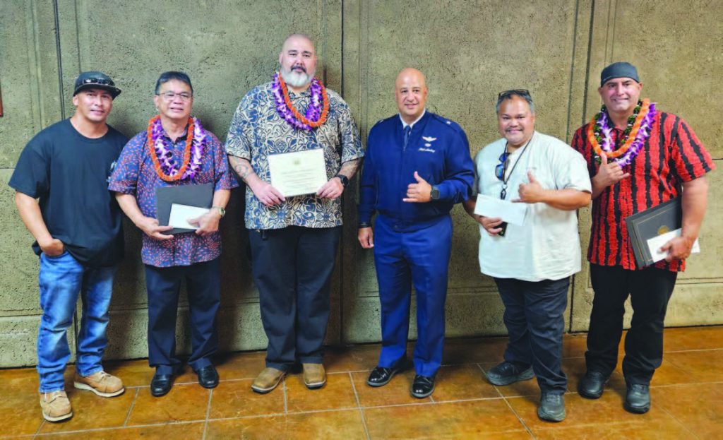 The Hawai‘i Department of Defense Incentive Service Awards winners attended the Governor’s Award Ceremony at the Hawai‘i State Capitol Auditorium on Sept. 22, 2025. Recognized at the event were Ramon Ramiro, Electrician I, 154th Civil Engineer Squadron (Adjutant General’s Award), Ronald Santos, Building Maintenance Worker II, Engineering Office (Manager of the Year) and the HIANG 154th Civil Engineer Squadron Maintenance Staff represented by Shane Harrell (Team of the Year). At top, HIANG 154th CES Maintenance member Keola Adaro, Ramon Ramiro, Shane Harrell, Hawai‘i Deputy Adjutant General Brig. Gen. Phillip L. Mallory, HIANG 154th CES Maintenance supervisor Geronimo Angeles and Ronald Santos attended the ceremony. – Photos by Nicole Sugai