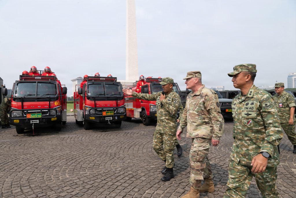 Lt. Col. TNI AU Antonius Ernesto provided a capabilities briefing during a static display of riot control equipment hosted by Kodam Jaya/Jayakarta at the National Monument in Jakarta, Indonesia, on June 11. The presentation provided U.S. Army Maj. Gen. Stephen F. Logan, adjutant general of Hawaiʻi, members of the Hawaiʻi National Guard delegation and U.S. Indo-Pacific Command representatives with an overview of equipment, tactics and operational capabilities used in public order and security operations. (U.S. Air National Guard photos by Senior Master Sgt. Mysti Bicoy)