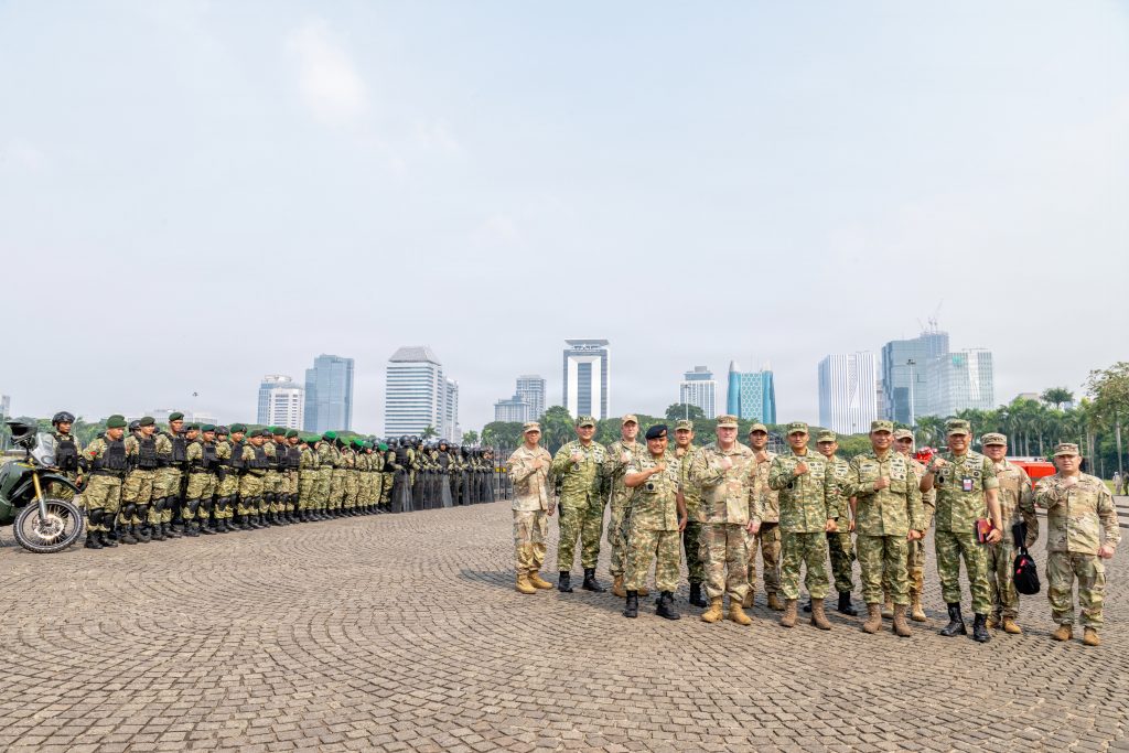Indonesian military leaders, U.S. Pacific Command representatives and members of the Hawaiʻi National Guard delegation took a photo during a static display of riot control equipment at the National Monument in Jakarta. (U.S. Air National Guard photos by Senior Master Sgt. Mysti Bicoy)