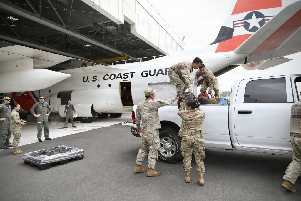 The Hawaii National Guard’s 93rd Chemical, Biological, Radiological, Nuclear and Explosives Enhanced Response Force Package team loaded essential equipment onto a U.S. Coast Guard C-130 in support of recovery operations at Barber’s Point on O‘ahu on Aug. 16. (U.S Army National Guard photo by Spc. Daniel Barcenas)