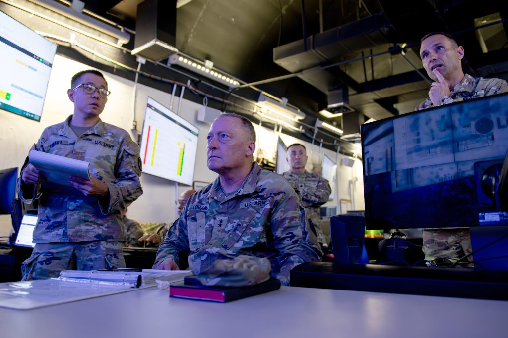 Maj. Gen. Stephen Logan, Adjutant General for the state of Hawai‘i, center, received a brief from Maj. Mike Tanaka, left, Hawai‘i National Guard (HING) Joint Staff battle major, and Brig. Gen. Damon Hogsten, director of the HING Joint Staff, on Hurricane Lowell storm preparations on Sept. 7. In preparation for Hurricane Lowell, the HING pre-positioned personnel, equipment and high-wheeled vehicles on Kaua‘i and were ready to respond to requests. (U.S. Army National Guard photo by Staff Sgt. John Schoebel)