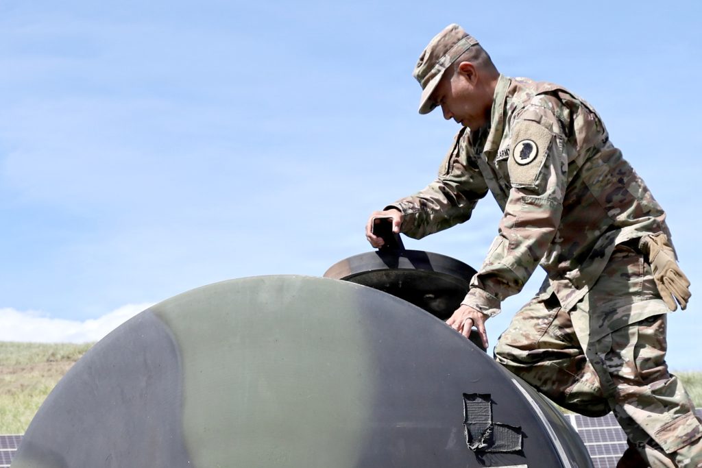 Sgt. Philip Lapid, assigned to Task Force Kaua‘i, Hawai‘i National Guard, closed the lid on a 400-gallon water buffalo in Keālia on Sept. 8. Providing safe drinking water was one of the tasks to help the community after Hurricane Lowell. (U.S. Army National Guard photo by Staff Sgt. Randall Corpuz)