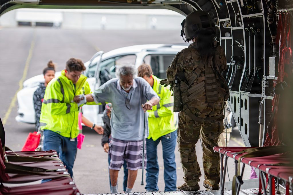 Critical care patients boarded a Hawai‘i National Guard (HING) CH-47 Chinook helicopter in Līhu‘e, Hawaii, on Sept 10. The HING assisted with transporting patients to O‘ahu after extended power outages on Kaua‘i caused delays in essential medical treatment. (U.S. Army National Guard photos by Staff Sgt. John Schoebel)