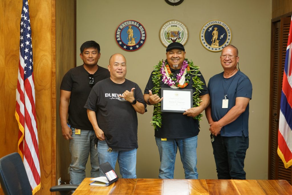 Above, Patrick Tangonan, second from right, posed for a photo with fellow Hawai‘i Department of Defense Engineering Office co-workers Irwin Gamboa, left, Harlan Tasaka and Kevin Ancog on Aug. 28. (Photos by Ruben Duldulao)