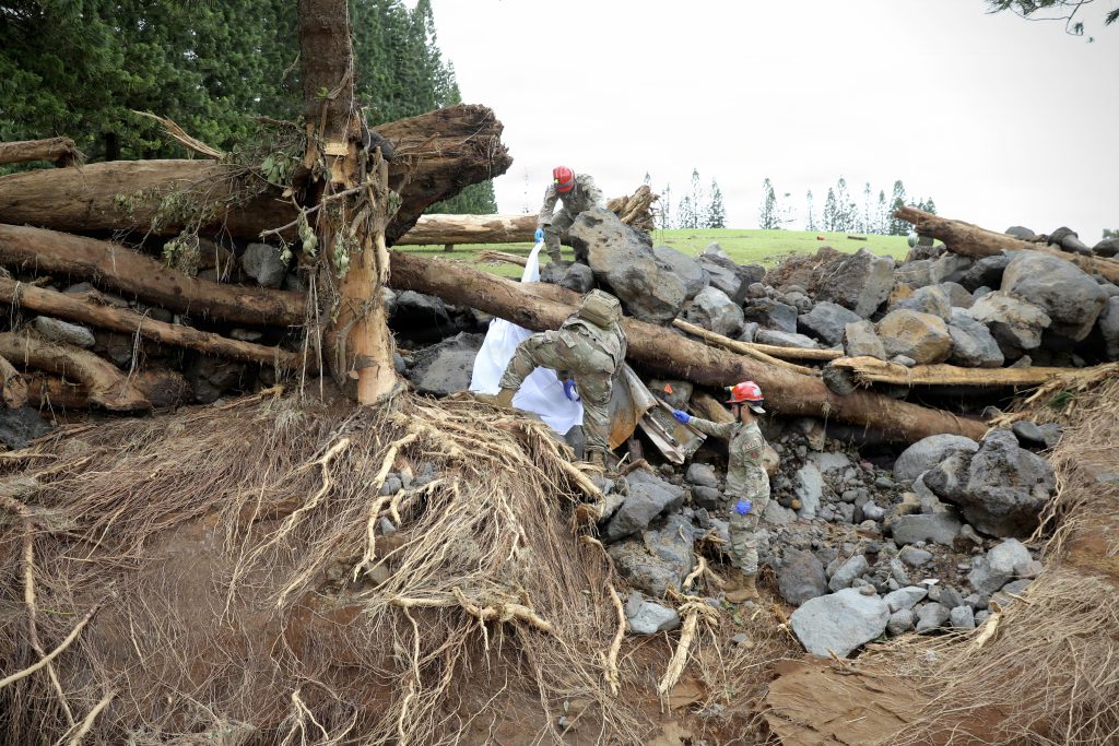 Hawai‘i National Guard worked near a debris-filled area in the Ka’ū District on Hawai‘i Island on Aug. 19 following impacts by Hurricane Lala. (U.S. Army National Guard photo by Spc. Daniel Barcenas)